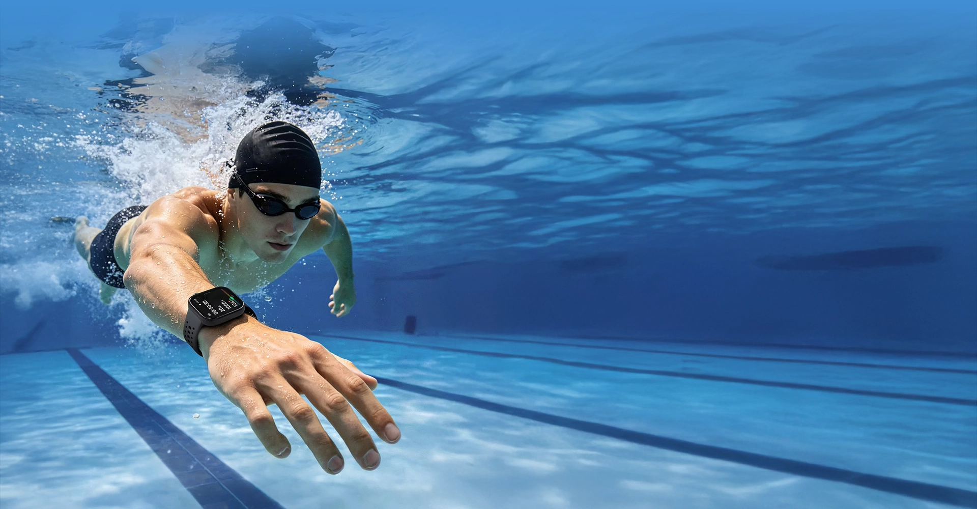 Nadador con smartwatch bajo el agua