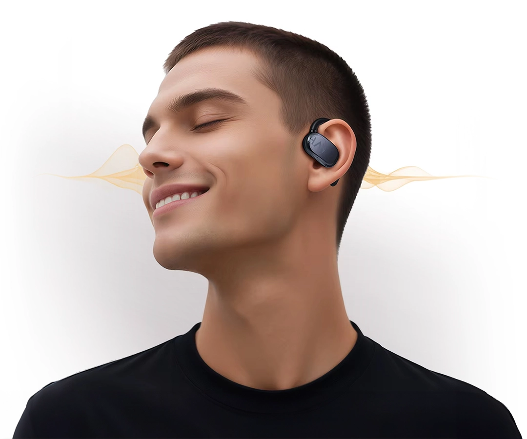 Man listening to music with Haylou Earhook 1 earphones