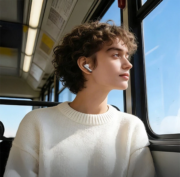 Passenger using HAYLOU Flowbuds N55 earbuds