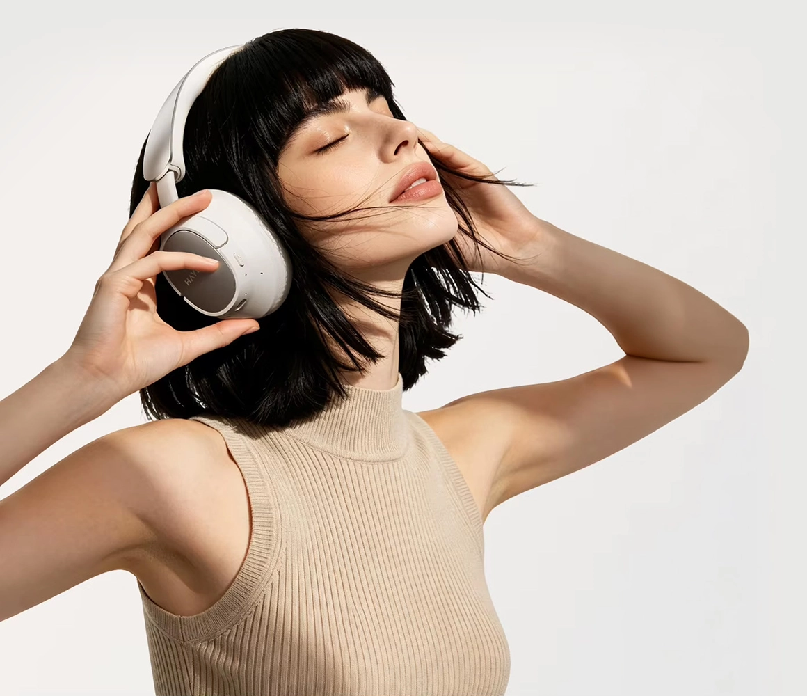 Woman wearing HAYLOU FlowLoop S33 headphones