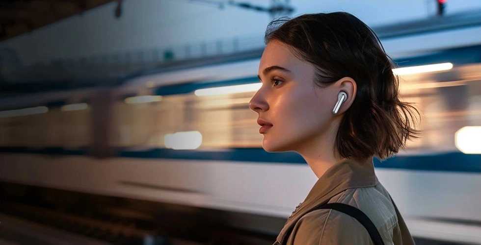 Woman using Haylou Mori Pro on public transport