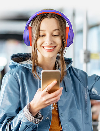 Woman listening to music with Haylou S35 ANC headphones
