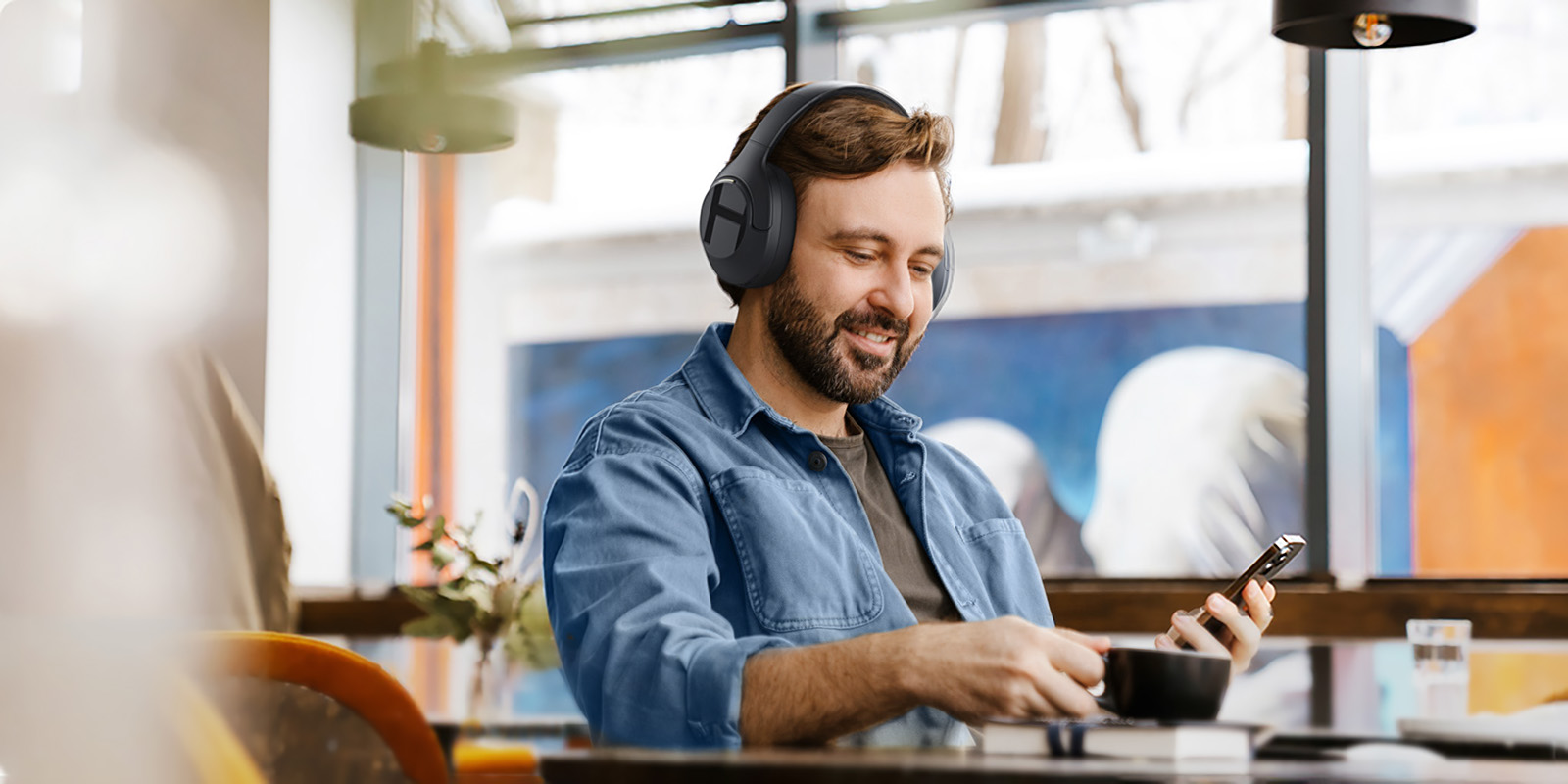 Man listening to Haylou S35 ANC headphones