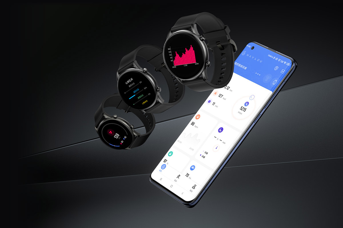 Three Haylou RT2 smartwatches next to smartphone